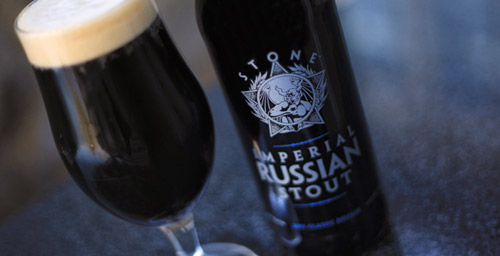 A glass and bottle of Stone Imperial Russian Stout