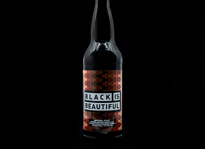 bottle of black is beautiful