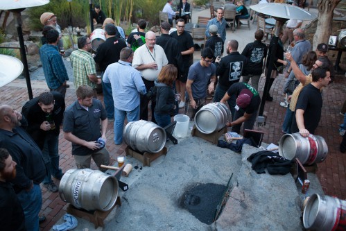 Brewers standing around casks