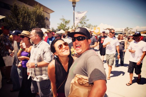 two fans posing and smiling