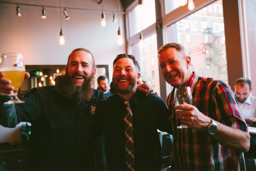 Greg Koch and Steve Wagner posing for a photo with beer