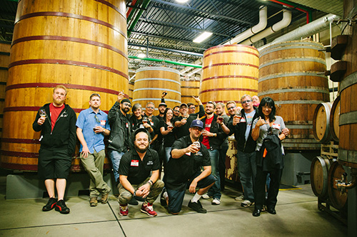 Team Stone in front of giant barrels