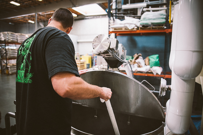 checking on a brewing beer