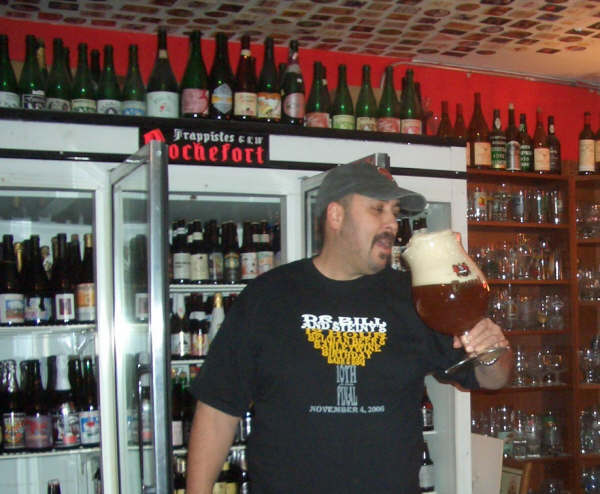 Dr. Bill enjoying a choice beverage in his personal cellar