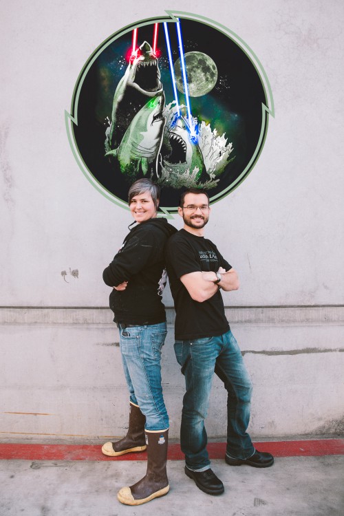 Hollie and Eric in front of laser shark art