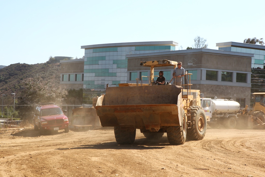 Greg & Steve drive a bulldozer in Greg & Steve pull up to the groundbreaking ceremony in style