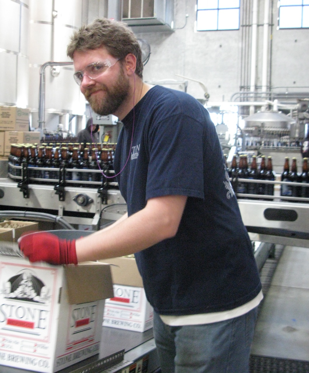Beau Bratton Beau Bratton manually breaking box tabs, folding, and sealing.
