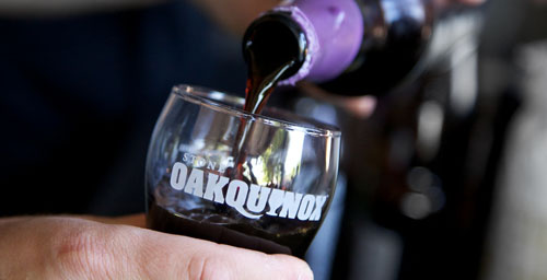 Pouring beer into a Stone Oakquinox glass