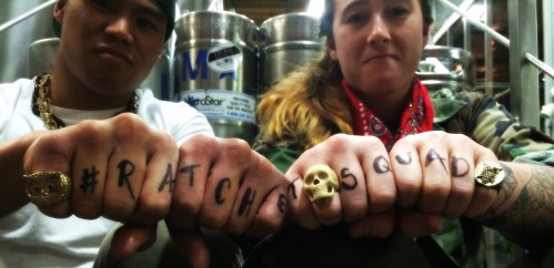 Justin and Rian with #ratchetsquad written on their knuckles