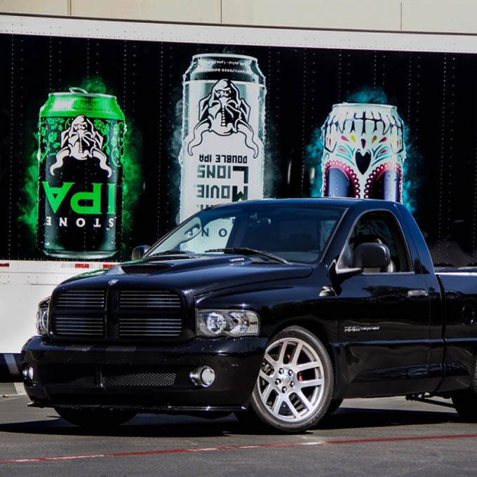 pick-up truck in front of Stone Brewing delivery truck