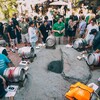 Brewers gathered around casks