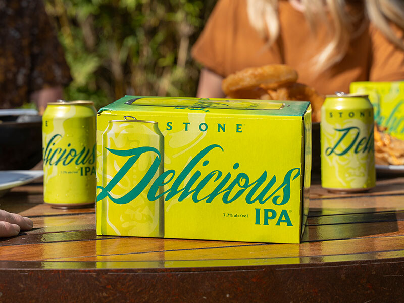 Stone Delicious IPA cans and six-pack