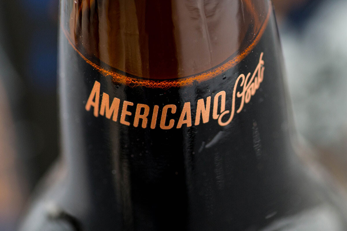 close up on bottle neck of a Stone Americano Stout