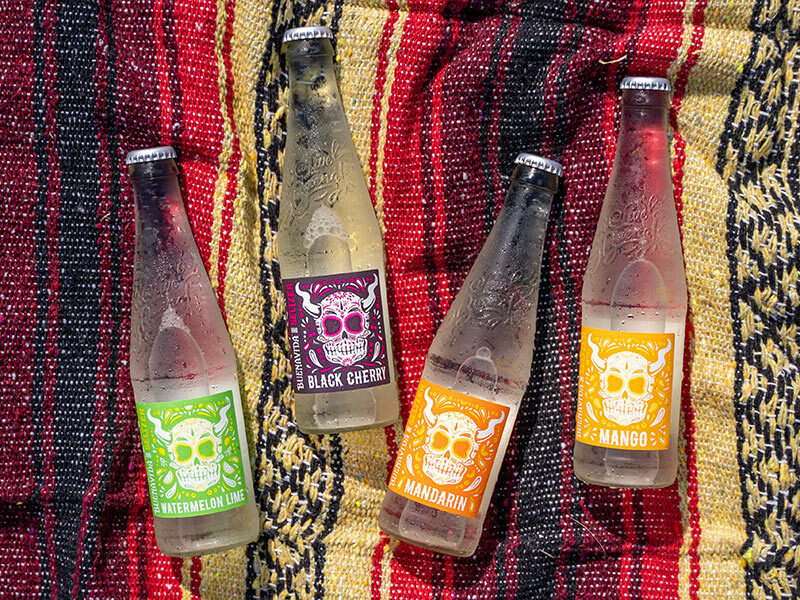 bottles of buenavida on festive blanket