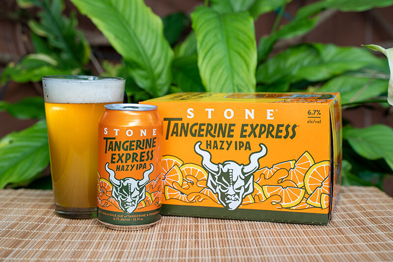 Stone Tangerine Express hazy IPA can, glass and six-pack cans