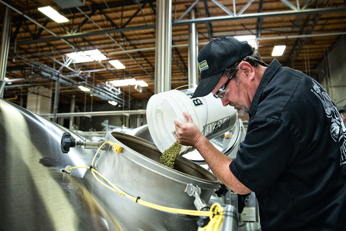 Mitch Steele pouring hops