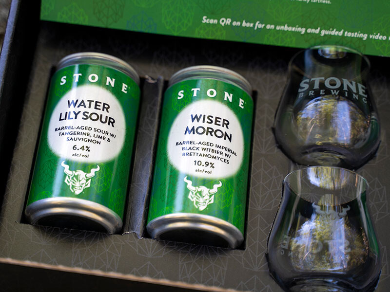 left two beer cans in tasting box