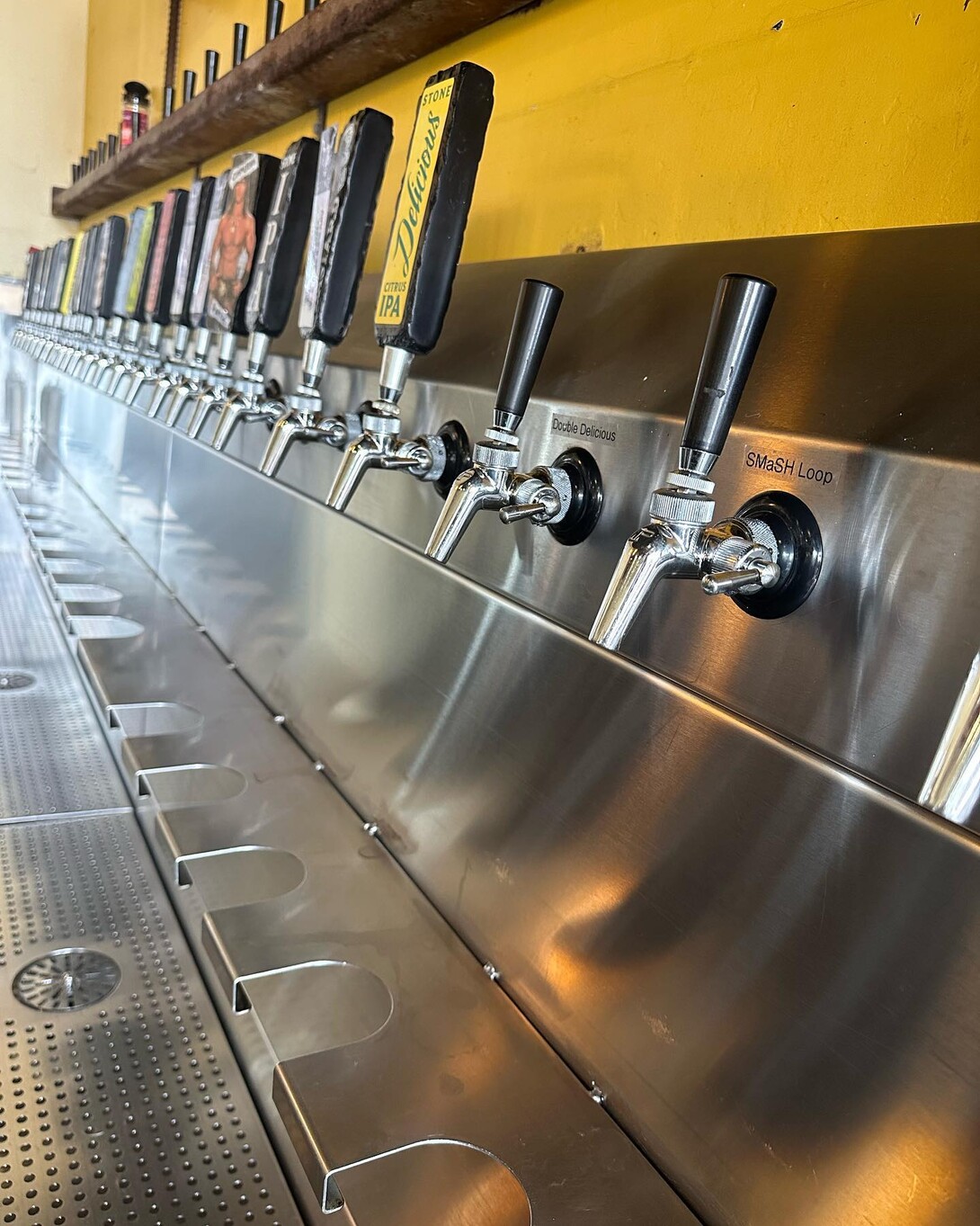 shot of the taps at stone brewing tap room oceanside