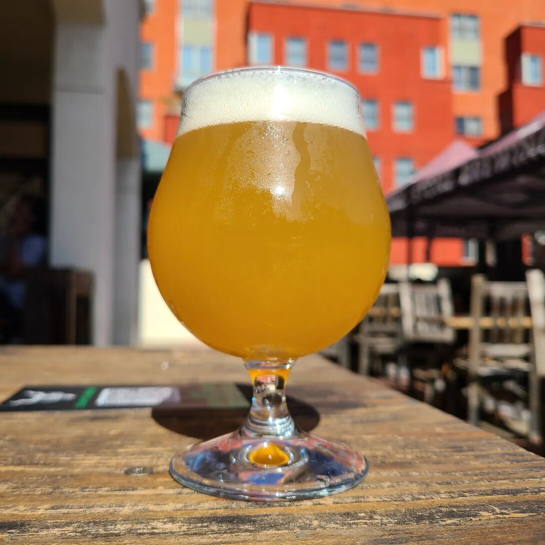 a glass of a hazy ipa at stone brewing pasadena